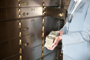 Putting cash in safety deposit box